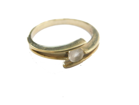 A crossover dress ring, set with white stone, marked 375, size N, 2.3g all in.