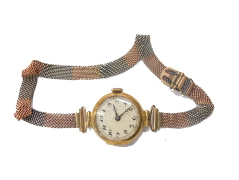 A 9ct gold cased wristwatch, with 1.5cm diameter Arabic dial, with mesh work bracelet marked 9ct, 15.6g all in.