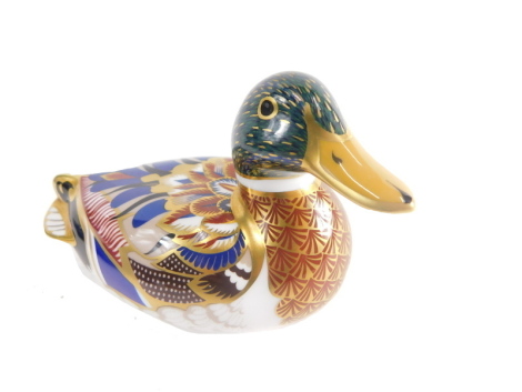 A Royal Crown Derby paperweight ornament duck, silver stopper, printed marks beneath, 9cm high.