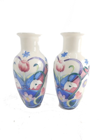 A pair of Old Tupton ware tube lined vases, 21cm high.