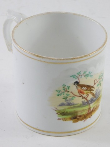 A 19thC porcelain cup, with gilt highlights and ear handle, hand painted with a bird in a naturalistic setting, unmarked, 9cm high.