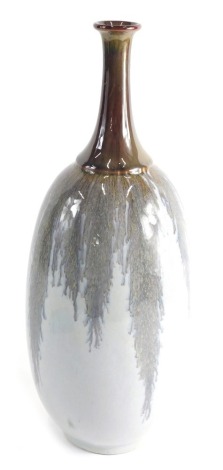 A 20thC pottery Pilkington style vase, in a drip grey glaze, with trumpet stem, unmarked, 41cm high.