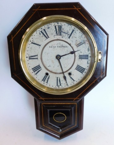 Seth Thomas of USA. An American drop dial wall clock, in mahogany and simulated inlaid case, with circular paper dial and octagonal case, 53cm high.