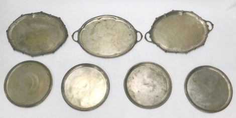 Various silver plated ware, a set of four partially chased serving plates or dishes, each of circular form, decorated with flowers, 45cm wide, and two large silver plated trays. (a quantity)