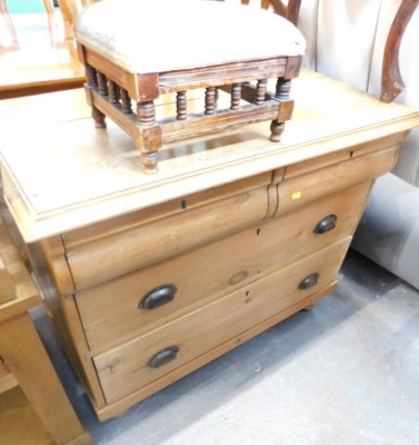 A pine chest, with two cushioned drawers above two long drawers.