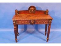 A Victorian carved oak hall table