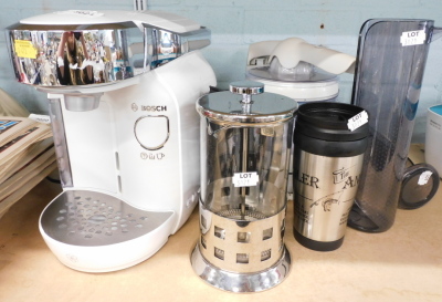 A Bosch Tassimo coffee maker, with accessories, and a food mixer.