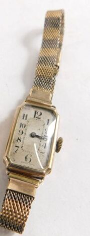 An early 20thC Art Deco wristwatch, with Arabic dial and rolled gold and silver meshwork bracelet.