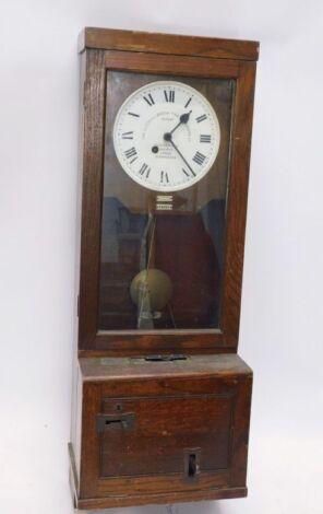 A 20thC Gledhill-Brook oak cased time recorder clock, the 25cm diameter Roman numeric dial, in oak case with metal fittings, 121cm high.