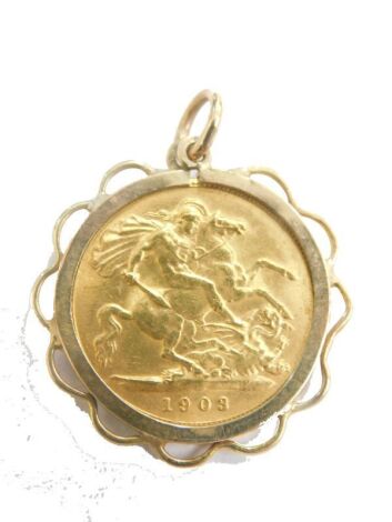 A Edward VII gold half sovereign in 9ct gold mount, 3cm high, 5.2g all in.