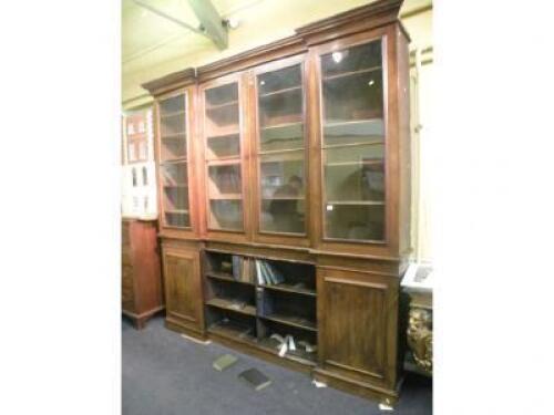 A Victorian oak inverted breakfront bookcase