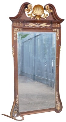 A 19thC parcel gilt walnut pier glass or wall mirror, with broken arch pediment, with shell and scroll decoration, bevelled rectangular plate, 180cm high, 93cm wide.