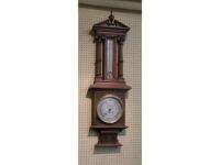 A late Victorian oak aneroid barometer and thermometer