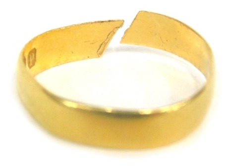 A 22ct gold plain band, cut, 1.7g (AF)