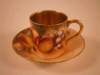 A Royal Worcester fruit painted coffee can and saucer decorated