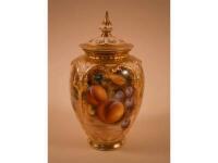 A Royal Worcester porcelain pot pourri jar and cover decorated with fruit