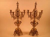 A pair of French gilt brass six branch candelabra each decorated with grapes