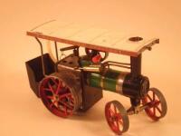 A Mamod model of a vintage steam tractor with canopy