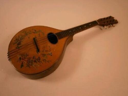 A simulated rosewood and stained beech mandolin decorated with printed flowers