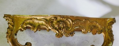 A late 18th/early 19thC giltwood console table, with a serpentine fronted variegated white marble top, the base carved with rococo scrolls, flowers, etc., on cabriole legs with shaped stretcher, 83cm high, 116cm wide, 58cm deep. - 2