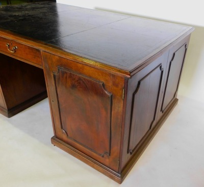 A 19thC mahogany partner's kneehole desk, the rectangular top with a black tooled leather inset and a moulded edge, above an arrangement of one drawer and two panelled doors to each side, on a plinth, 83cm high, 189cm wide, 118cm deep. - 2