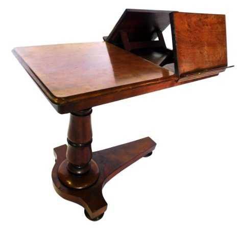 An early Victorian plum pudding mahogany metamorphic reading and music table, the rectangular top with a moulded edge, and two ratcheted stands for sheet music, on an adjustable turned column and concave base, with bun feet and castors, 73cm high, 81cm wi