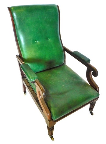 A George IV mahogany reclining armchair, upholstered in green leather, with a padded back, arm rest, seat, scroll carved supports, on turned tapering fluted legs, with brass castors. (AF)