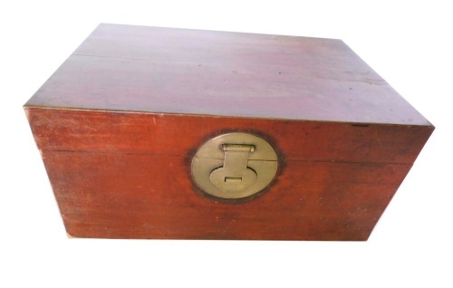 A Chinese camphor wood chest, with circular brass lock plate and brass drop handles, 46cm high, 94cm wide, 64cm deep.