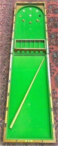 A Victorian mahogany bagatelle folding tabletop game.