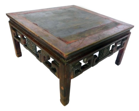 A Chinese hardwood coffee table, the square cleated top above a pierced carved frieze, on shaped legs, 51cm high, 92cm wide.