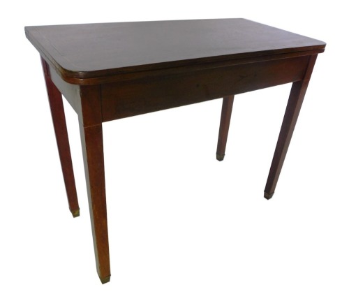 A 19thC mahogany and boxwood strung tea table, the rectangular top with rounded corners, on square tapering legs with square brass caps, 87cm wide.