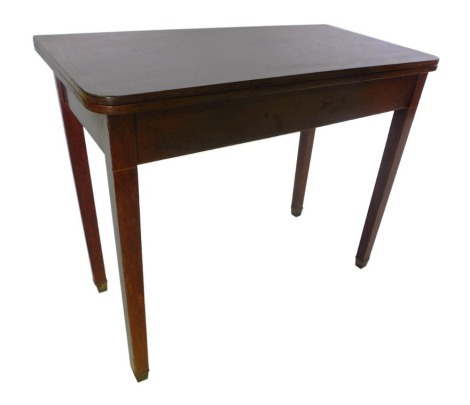 A 19thC mahogany and boxwood strung tea table, the rectangular top with rounded corners, on square tapering legs with square brass caps, 87cm wide.