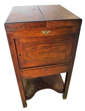 A 19thC Anglo Chinese campaign gentleman's wash stand, the hinged top revealing a vacant interior and adjustable mirror, above a door and a drawer, on plain supports with concave under tier, 87cm high, 45cm wide enclosed.