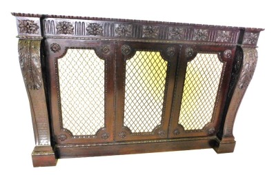 A mahogany side cabinet, with an inverted breakfront frieze carved with flutes, leaf patera, etc., above three doors each with brass grills, flanked by leaf carved brackets, on a plinth, lacking top, 104cm high, 162cm wide. (AF)