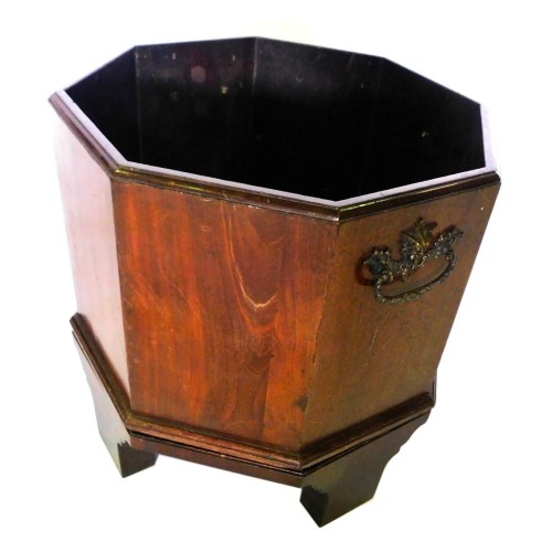 A mahogany celarette, of octagonal form, with bronzed metal handles, on tapering supports, 46cm high, 44cm wide.