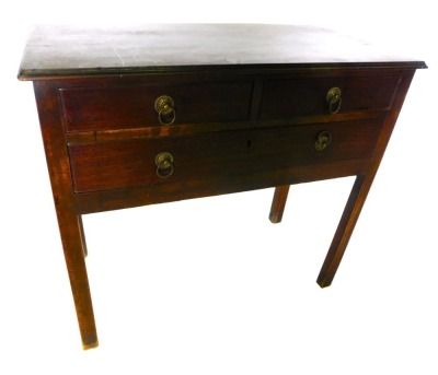 A George III mahogany lowboy, the rectangular top with a moulded edge, above two short and one long drawer, with brass ring handles, on plain supports, 74cm high, 3cm wide, 43cm deep.