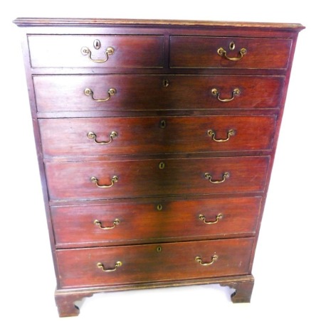 A George III mahogany tall chest of drawers, the rectangular top with a moulded edge, above two short and five long drawers each with brass drop handles, on bracket feet, 150cm high, 110cm wide, 50cm deep.