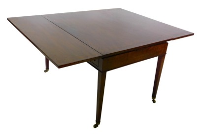 A Continental metamorphic extending dining table/writing table, with one leaf, the rectangular top above an arrangement of three frieze drawers flanked by three false drawers, on square tapering legs, with brass castors, 73cm high, 152cm wide, 117cm deep