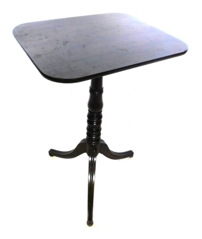 A 19thC mahogany tilt top occasional table, the rectangular top with rounded corners, on a turned column and tripod base, with bun feet, 73cm high, 48cm wide.