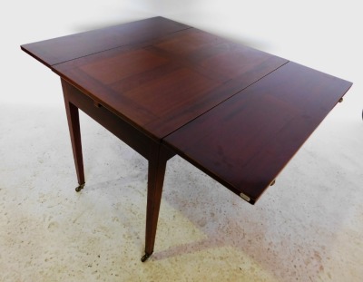 A mahogany and boxwood strung draw leaf dining table, the rectangular figured top above a plain frieze, on square tapering legs, with brass castors, 74cm high, 92cm wide, 119cm long. - 2