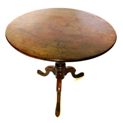 A George III mahogany tilt top supper table, the circular top on a turned column and tripod base, with pad feet, 72cm high, 81cm diameter.