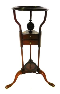 A 19thC mahogany wash stand, with a circular moulded recess for a bowl, on shaped supports with finial, above two triangular drawers, on turned supports with a further recess for a bowl, on cabriole legs, with pad feet, 77cm high, the top 30cm diameter.