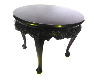 A mahogany centre table in mid 18thC style, with a circular top with a moulded edge, above an elaborately carved frieze with masks, scrolls, etc., on cabriole legs with ball and claw feet, 73cm high, 91cm diameter.