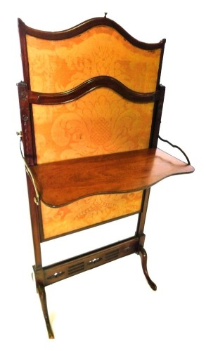 A late 19thC mahogany adjustable fire screen, with gold Damask insert, the ratchet mechanism for extending upwards, and a hinged shelf, on cabriole legs, 103cm high, 55cm wide.