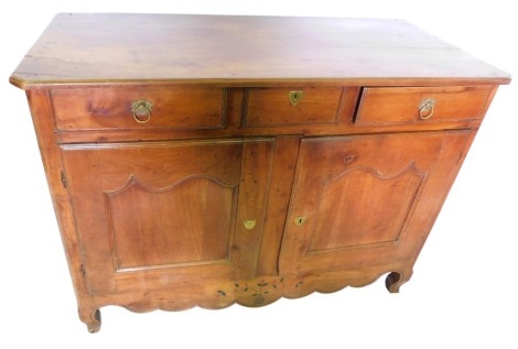 A 19thC French Provincial fruitwood side cabinet or dresser, the top with a moulded edge and canted corners, above three frieze drawers and two panelled doors, above an inlaid apron, on cabriole legs, 100cm high, 136cm wide, 63cm deep.