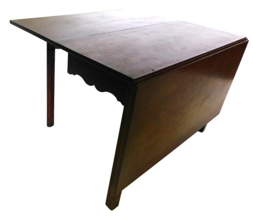 A George III mahogany drop leaf table, plain form with differing size leaves, and a shaped apron, 72cm high, 106cm wide.