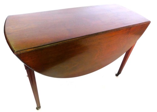 A late 19thC mahogany drop leaf table, the oval top with a moulded edge, above frieze drawer, on channelled tapering legs, with castors, 70cm high, 106cm wide.