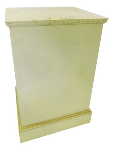 A cream painted pedestal, with a carved border, 82cm high, 53cm wide, 46cm deep.