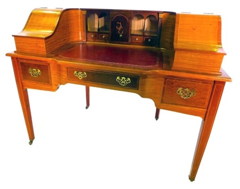 A late 20thC mahogany and satinwood Carlton House desk by Tom W Skeels, the raised back with two hinged compartments, one bearing plaque for Calrton House Desk Made By Thomas W Skeels Histon Cambridgeshire 1991-92, the other vacant, the central arched cup