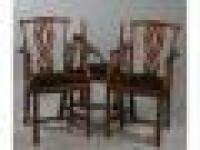 A set of three oriental hardwood elbow chairs in George III style